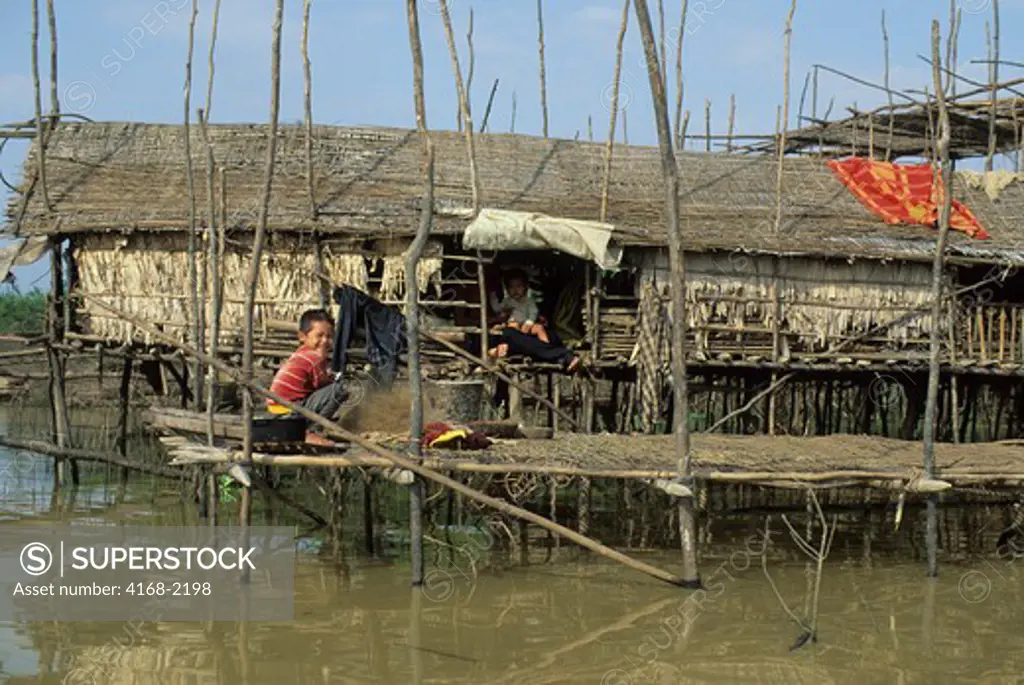 Cambodia, Near Siem Reap, Tonle Sap Lake, Floating Village, Local Boy