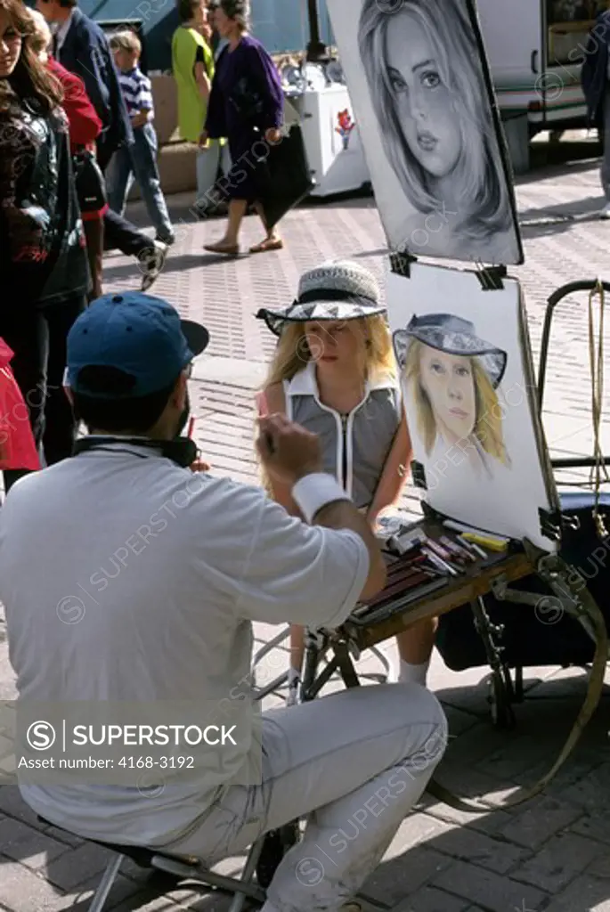 Russia, Moscow, Old Arbat Street, Portrait Artist Painting Girl