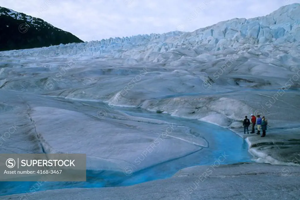 Usa, Alaska, Near Juneau, Mendenhall Glacier, Tourists On Glacier Looking At River On Ice