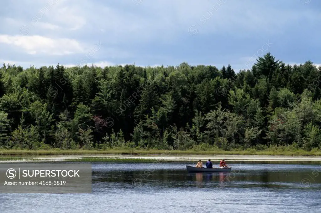 Usa, Maine, Near Greenville, Small Pond, People Fishing In Boat