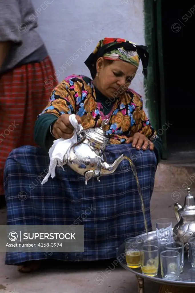 Morocco, Near Marrakech, Asni Valley,Ouirgan Village, Berber Woman Serving Tea