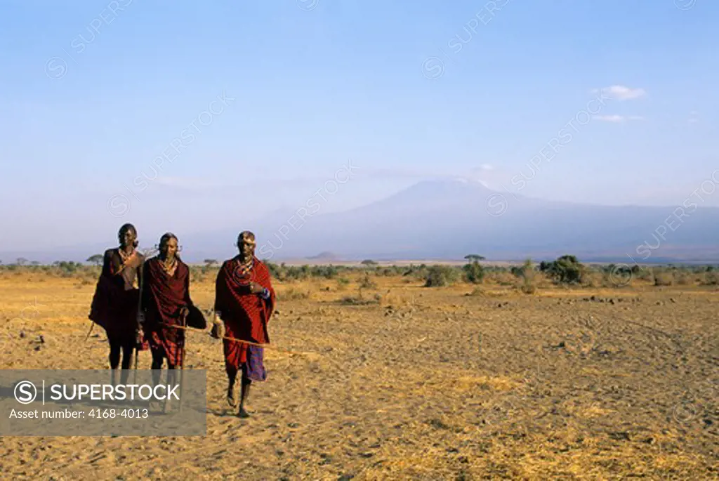 Kenya, Amboseli, Masai Men, Mt. Kilimanjaro In Background