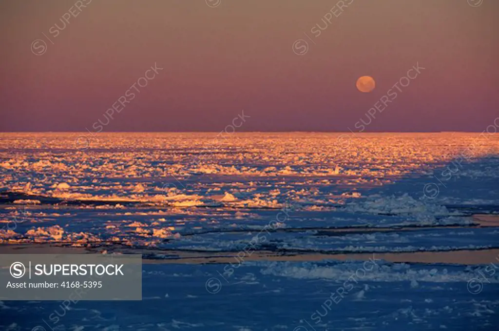 antarctica, weddell sea, pack ice in midnight sunshine with full moon