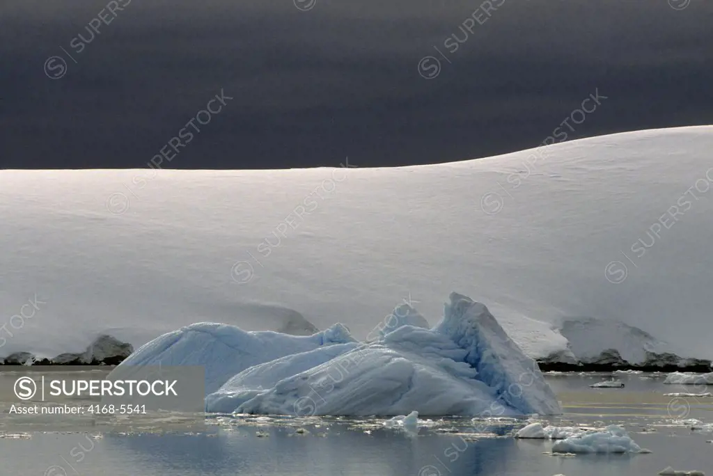 ANTARCTIC PENINSULA AREA, ICEBERG IN FRONT OF GLACIER