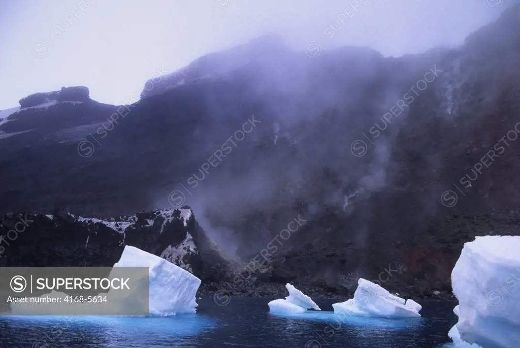 SOUTH SANDWICH ISLANDS, BELLINGSHAUSEN ISLAND, VIEW OF VOLCANIC FISSURES, STEAMING, ICEBERGS