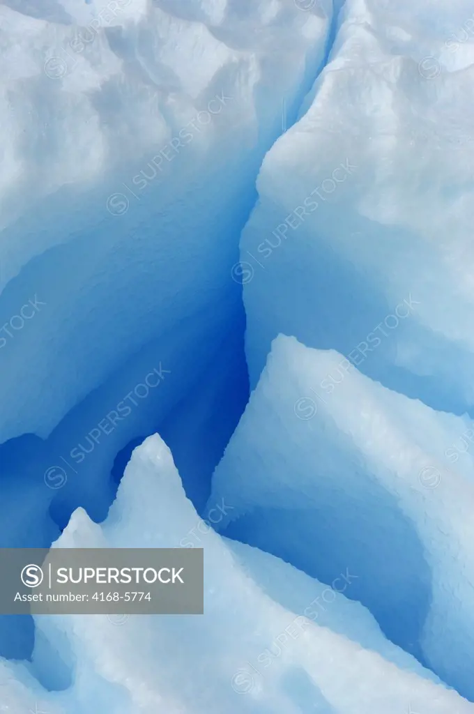 ANTARCTICA, ANTARCTIC PENINSULA, PLENEAU ISLAND, BLUE ICEBERG WITH CAVES