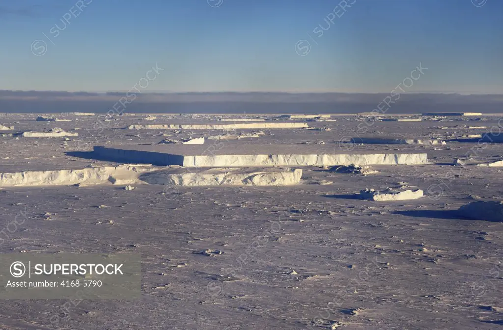 ANTARCTICA, WEDDELL SEA, SNOW HILL ISLAND, ICEBERGS FROZEN IN FAST ICE, AERIAL VIEW