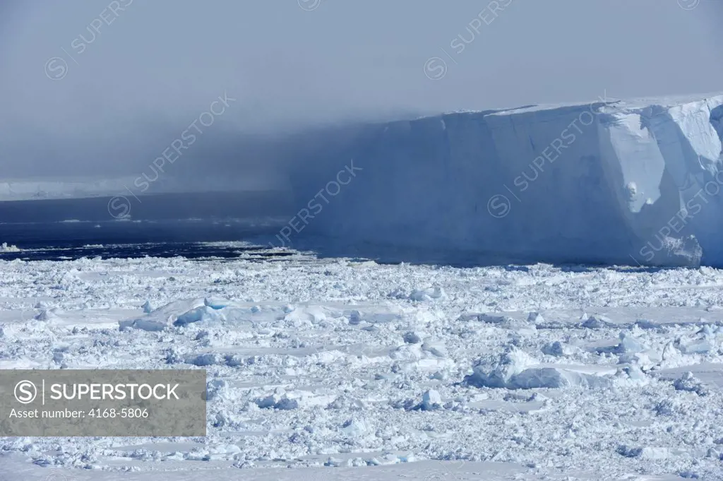 ANTARCTICA, WEDDELL SEA, STORM BLOWING OFF SNOW FROM TABULAR ICEBERG