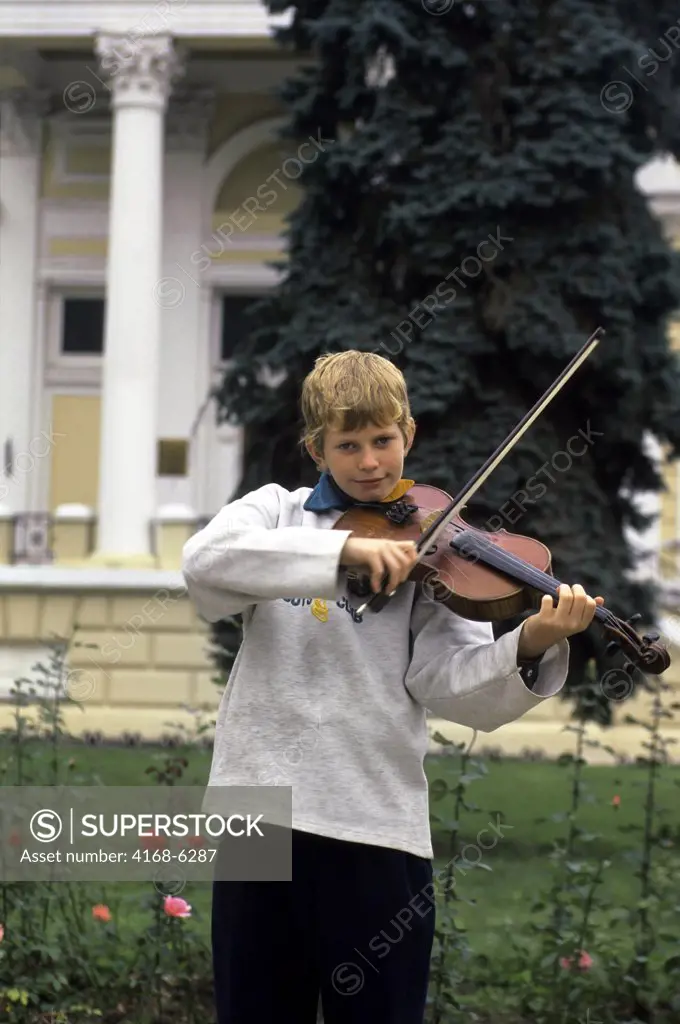 UKRAINE, ODESA, BOY PLAYING VIOLIN