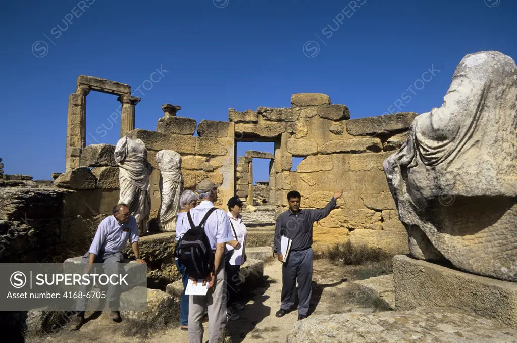 libya, near benghazi, cyrene, tomb of battus, statues, tourists