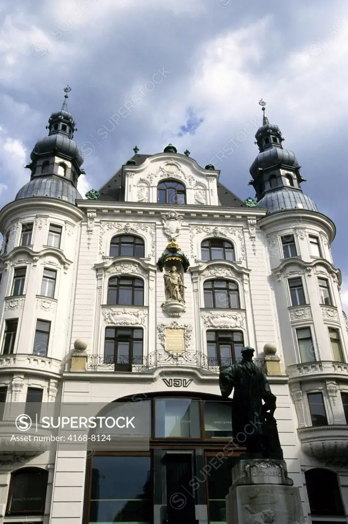Austria, Vienna, Local house with Johannes Gutenberg Monument in foreground