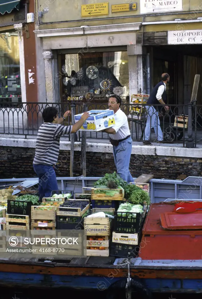 Italy, Venice, Fruits and vegetables unloading from boat