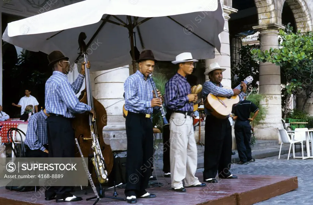 Cuba, Old Havana, Plaza De La Catedral, Cuban band playing at sidewalk cafe
