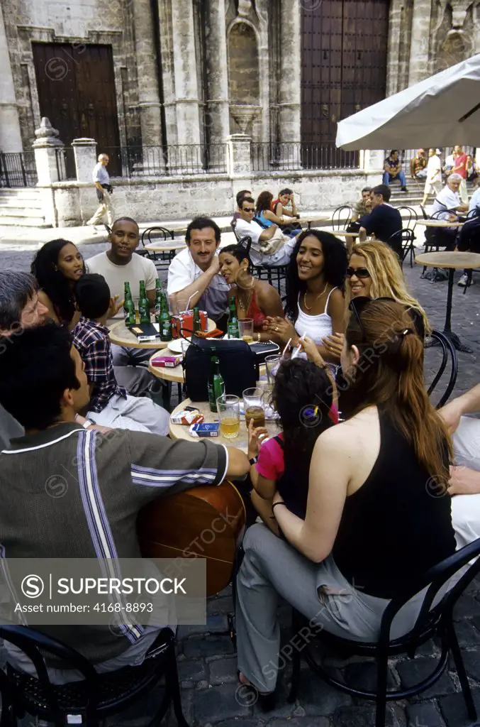 Cuba, Old Havana, Plaza De La Catedral, Local people playing music in sidewalk cafe