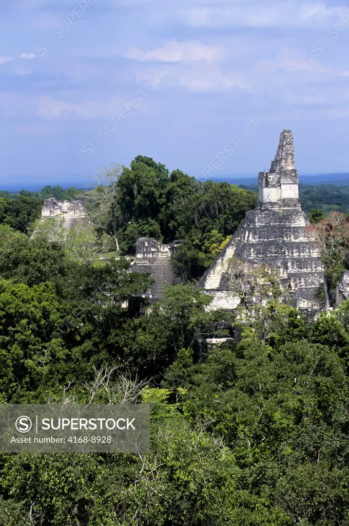 Guatemala, Tikal, View Of Grand Plaza, Temple I and rainforest from Temple V