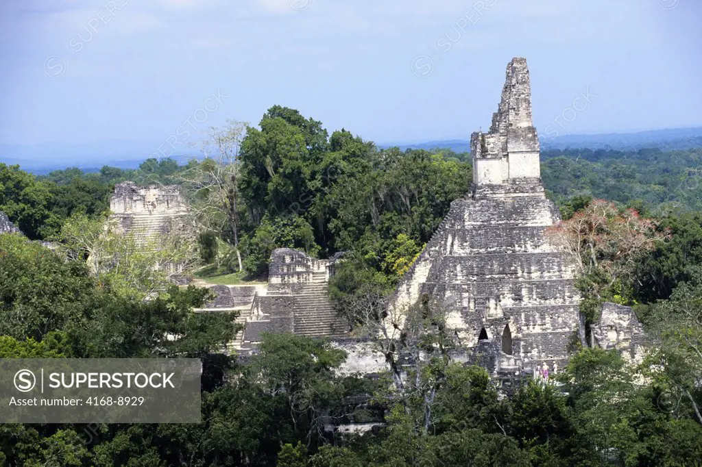 Guatemala, Tikal, View of Great Plaza, Temple I, and rainforest from Temple V