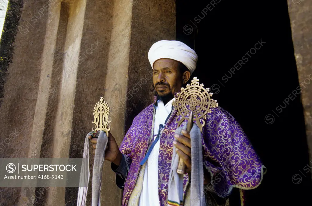 Ethiopia, Lalibela, Unesco World Heritage Site,  Church Carved Into Rock, Cross Church, Priest With Cross, Close-Up