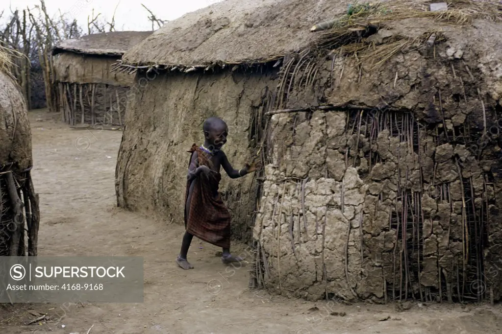 Tanzania, Near Ngorongoro Crater, Masai Village, Village Scene, Child With Hut