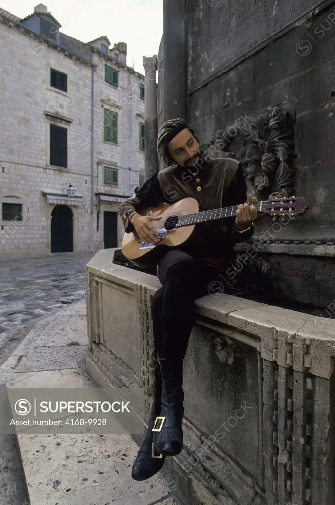 Croatia, Dubrovnik, Street Musician In Renaissance Clothing Playing Guitar