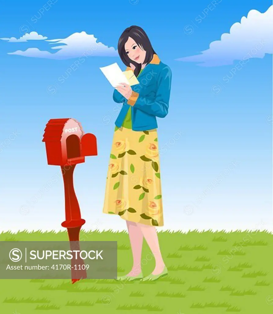 Woman reading a mail near a mail box