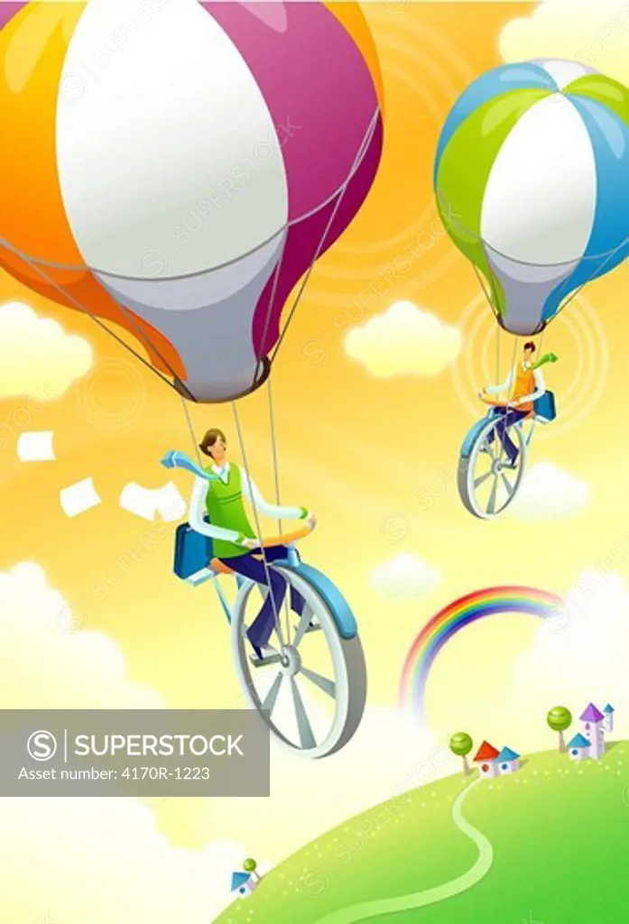 High angle view of two people unicycling with hot air balloons