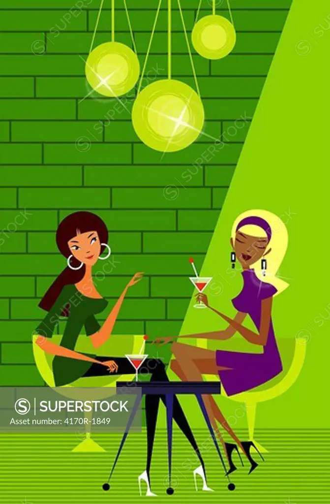Two women sitting in a nightclub