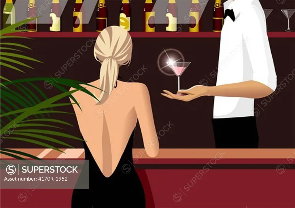 Mid section view of a waiter serving a glass of martini to a woman sitting at a bar counter