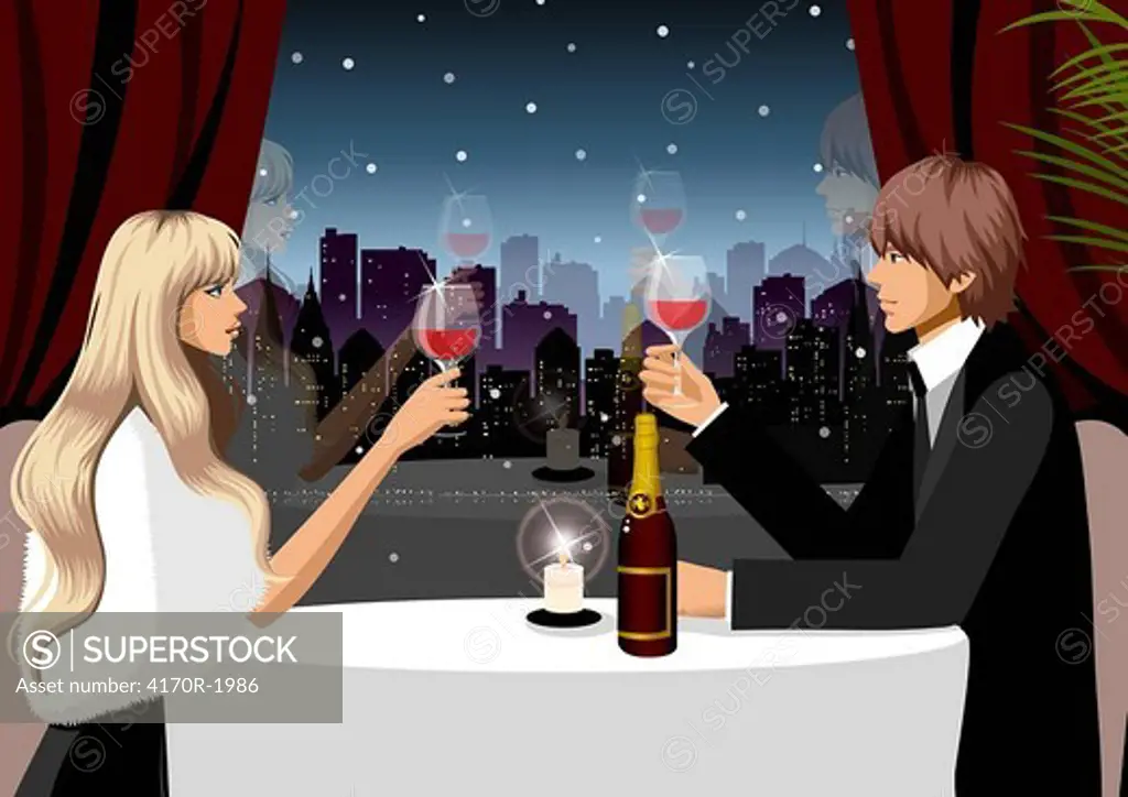Couple holding glasses of red wine in a restaurant