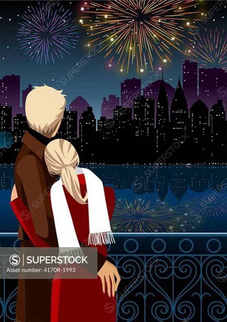 Couple watching firework display at night