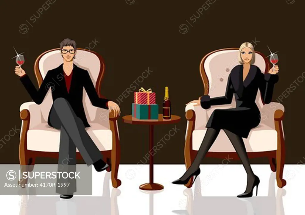 Couple sitting on armchairs and holding glasses of red wine
