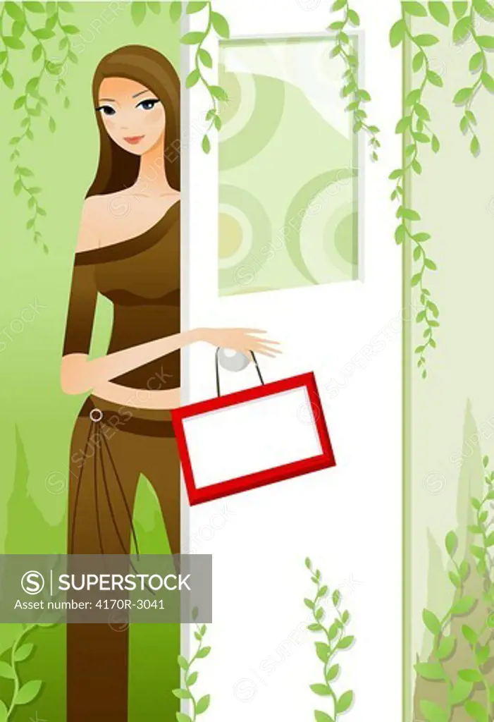 Young woman standing near a door