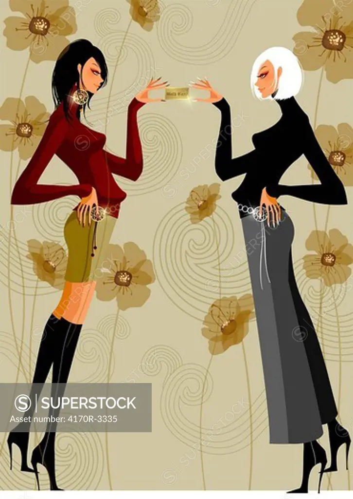 Side profile of two women holding a credit card and standing face to face