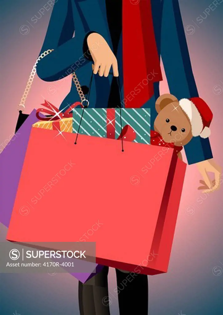 Mid section view of a woman carrying shopping bags