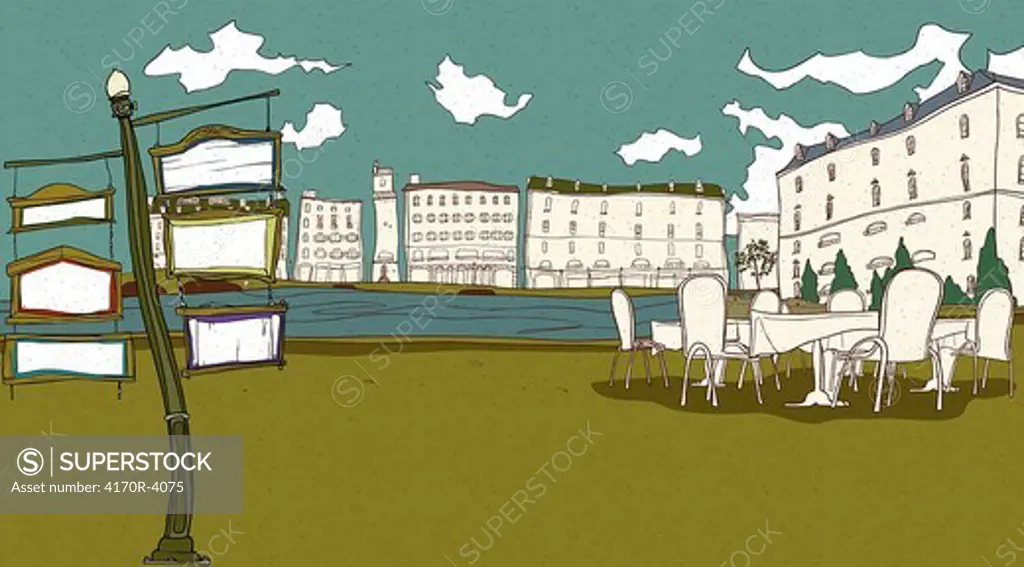 Cafe by river with buildings in the background