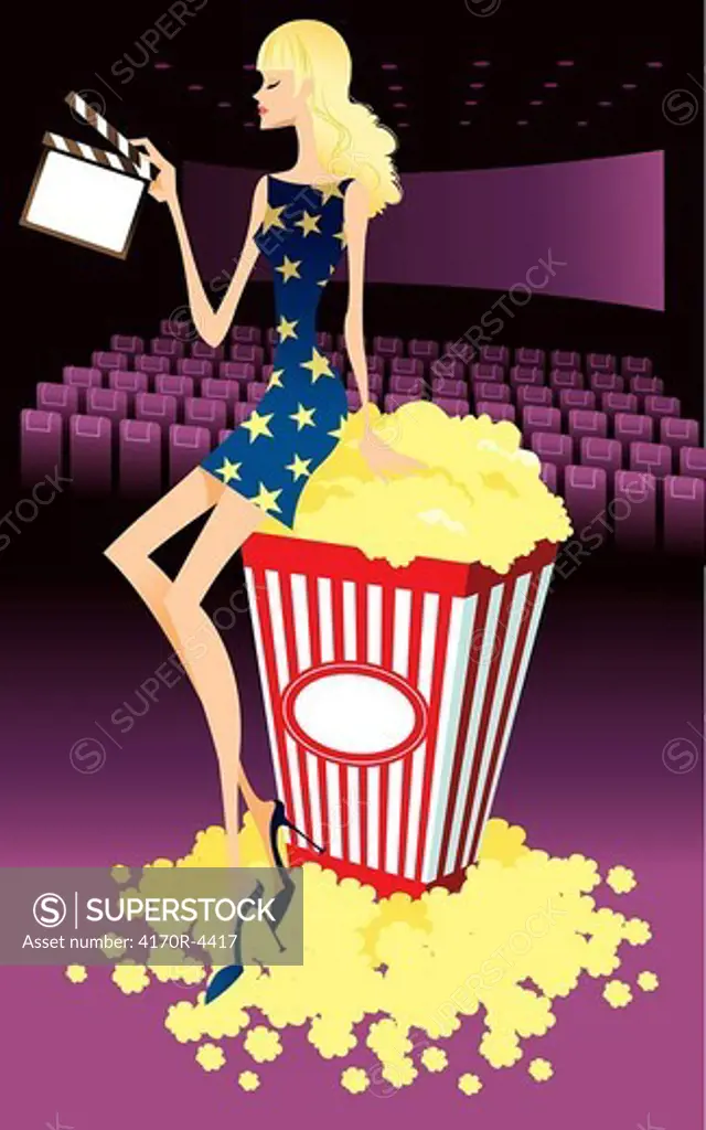Profile of woman sitting on carton of popcorn, holding film slate