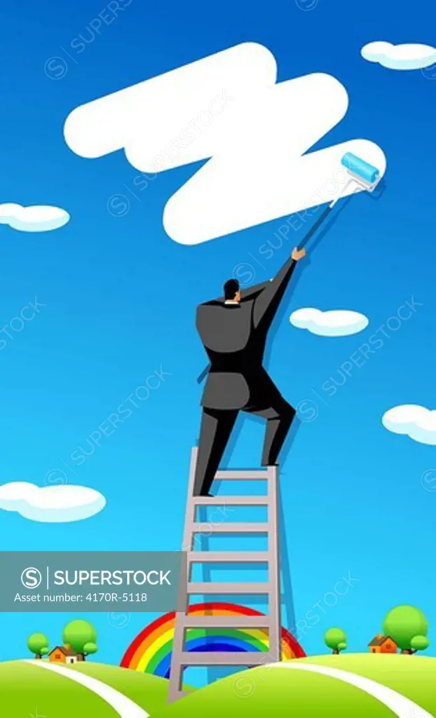 Rear view of a businessman painting in the sky