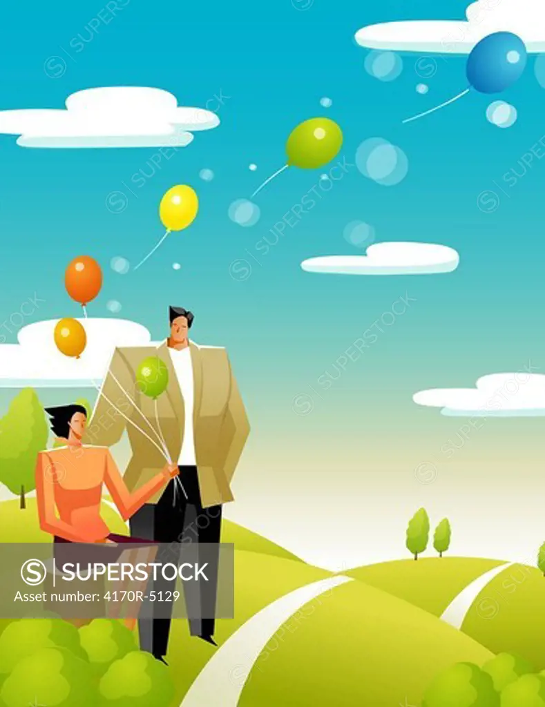 Woman holding balloons with a man standing beside her
