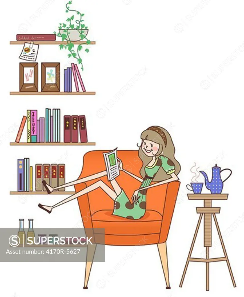 Woman sitting in an armchair and reading a book