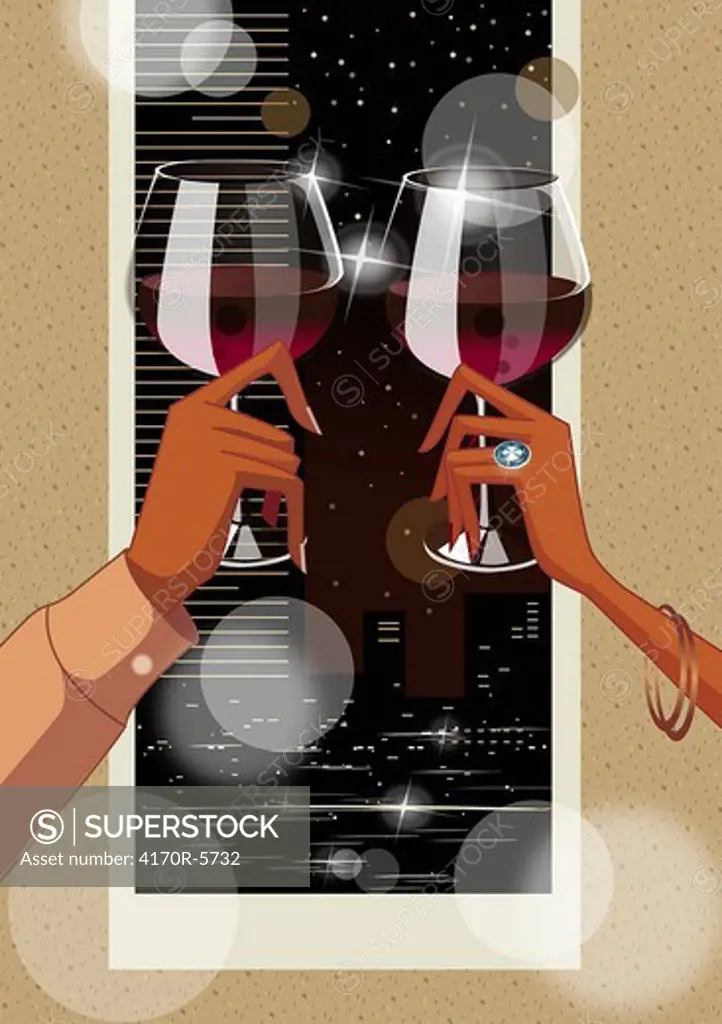 Close-up of a couple´s hands toasting with wine glasses