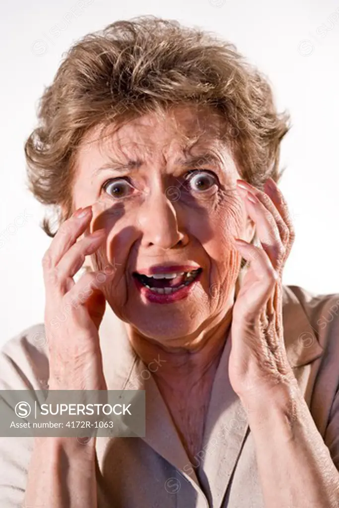 Elderly woman with frightened look on her face