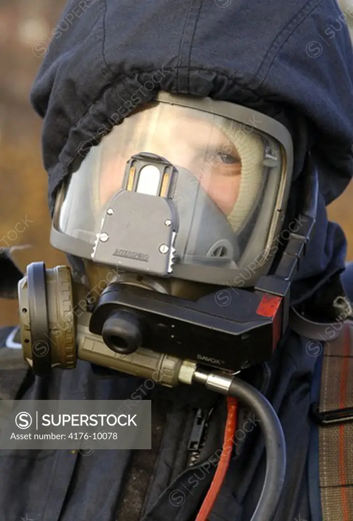 Close up portrait of a fire-fighter wearing mask