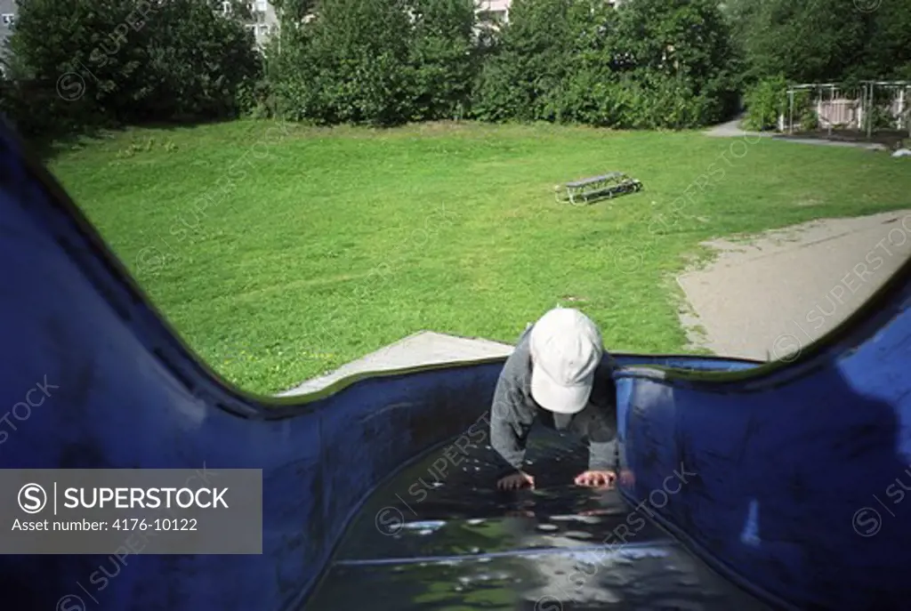 A small boy on a slide. Sweden