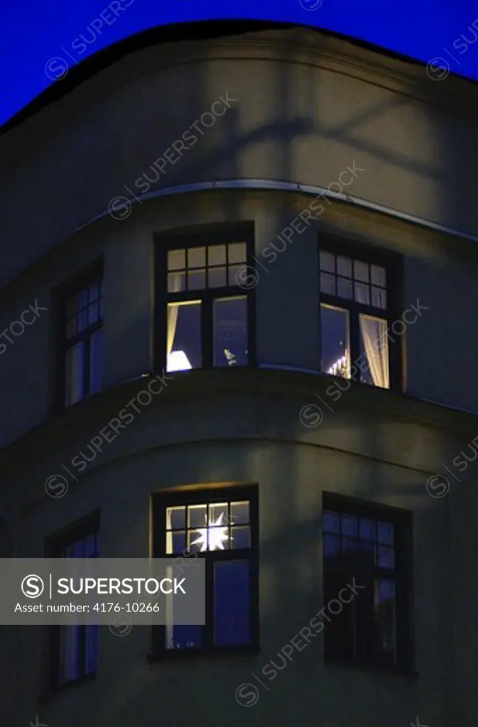 Low angle view of apartment building with windows at dusk in Stockholm