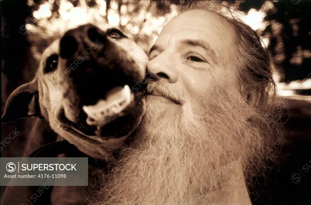 A long-white beard trainer with a dog