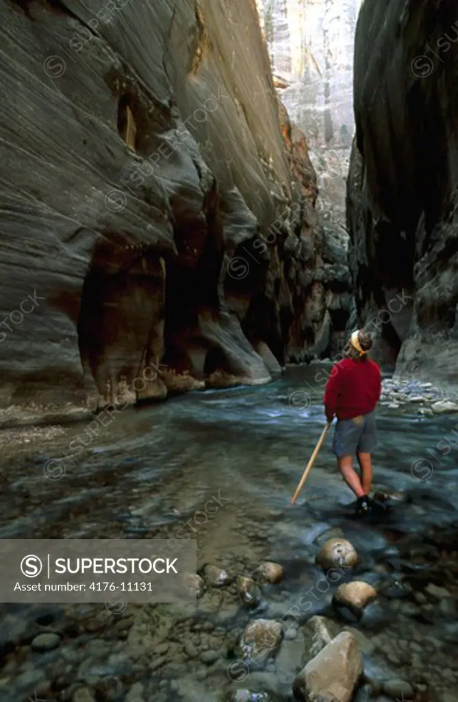 A man in the narrows of Zion national park in USA