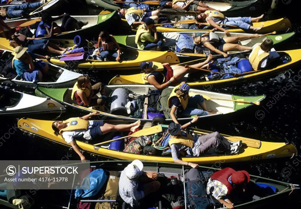 Overhead view of people resting in the boats