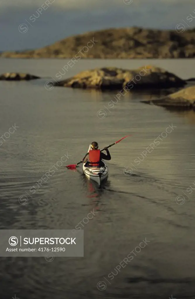 Rear view of a person kayaking in Bohuslan, Sweden