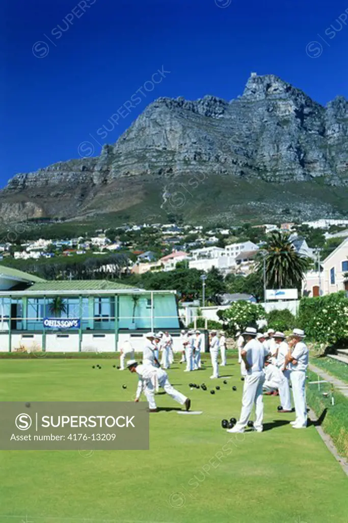 Lawn bowling club members at Camps Bay in Cape Town South Africa below Table Mountain