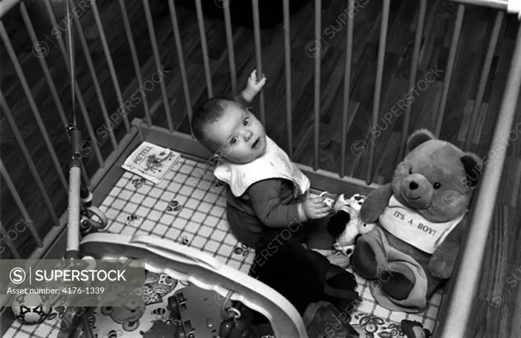 A baby in a playpen