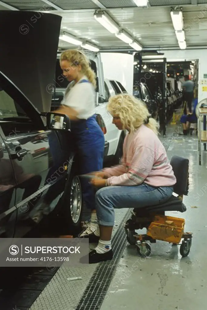 Women on auto assembly line at Saab Plant in Sweden